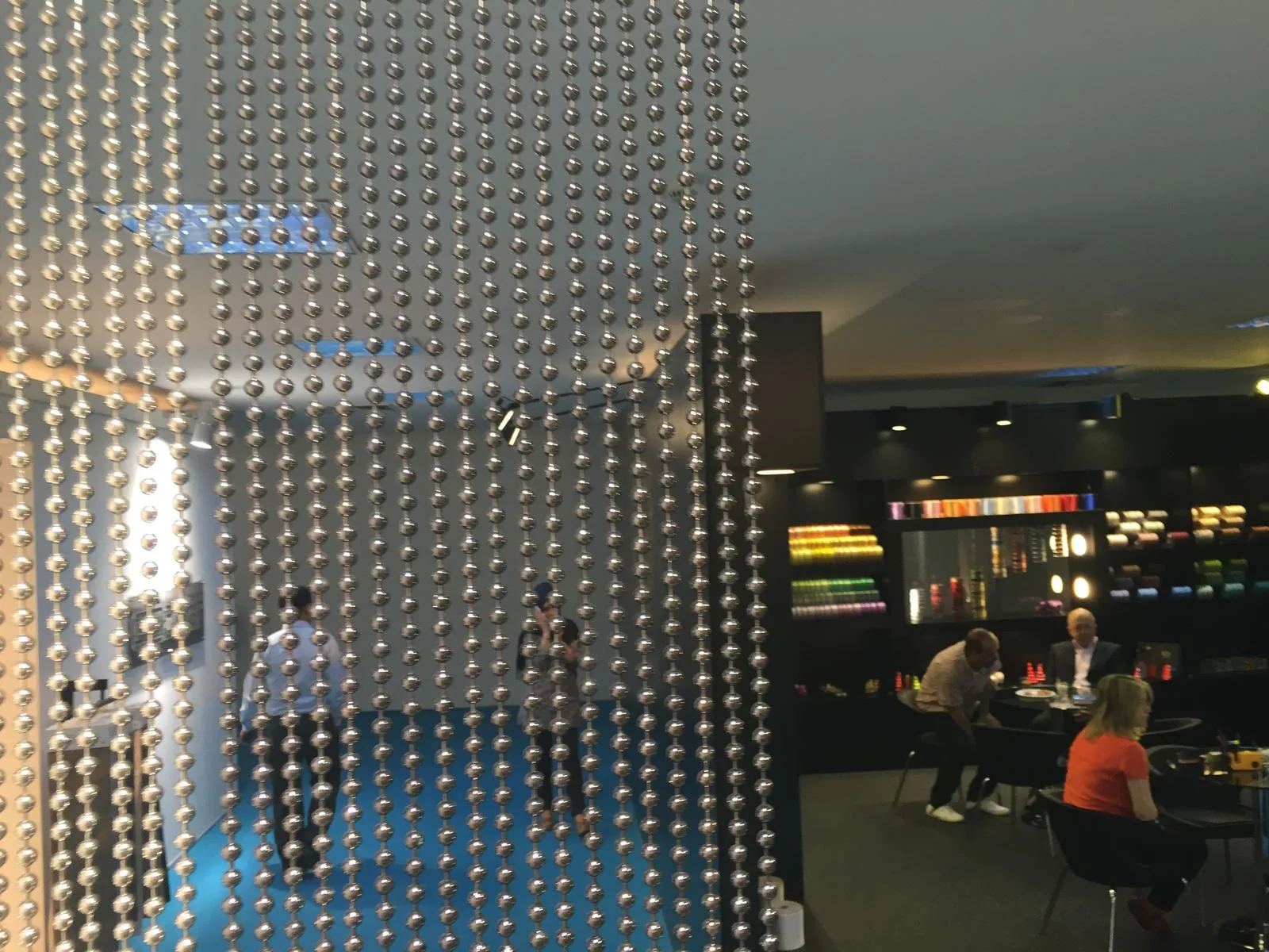 Metal chain room divider installation, view 1