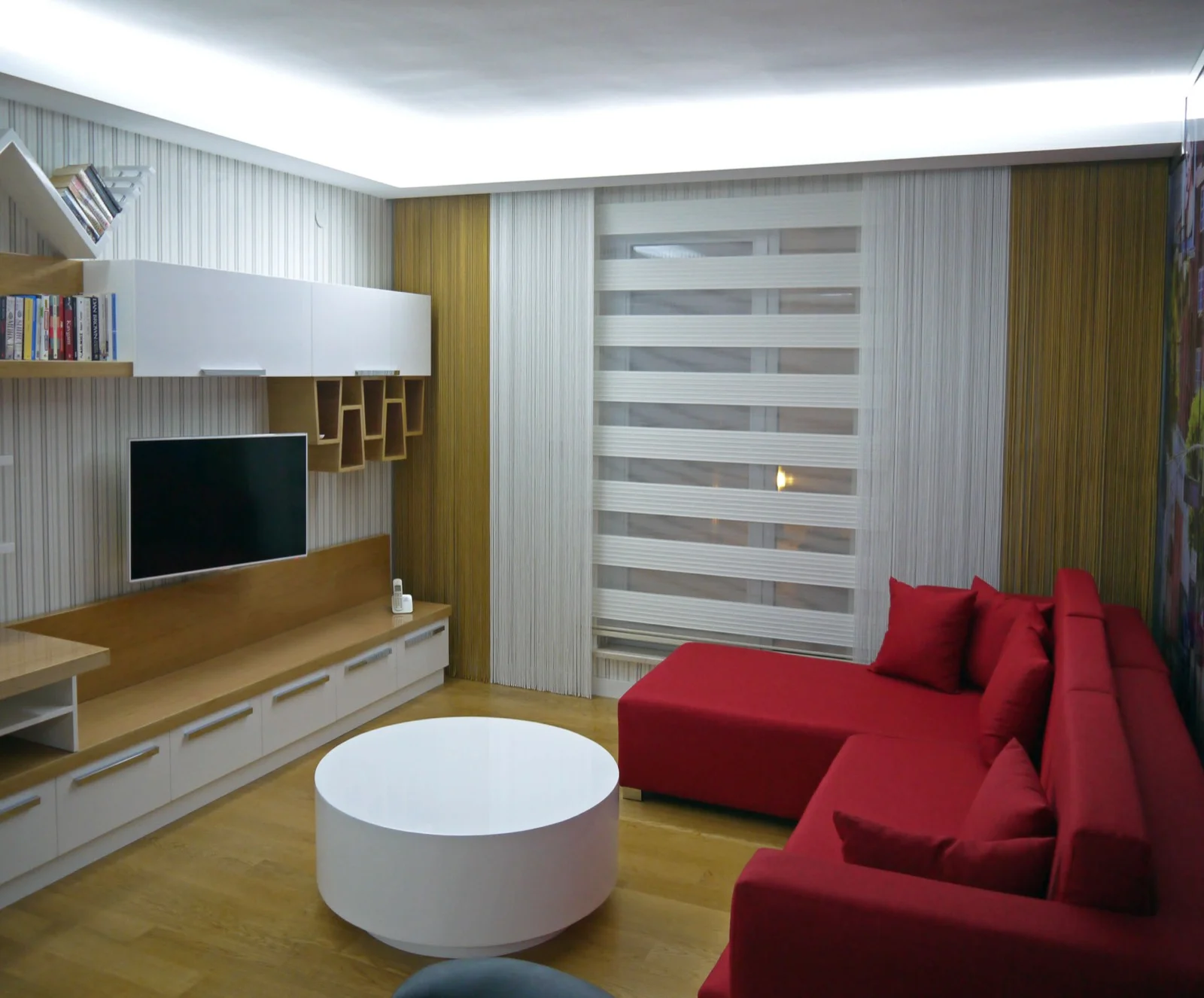 String curtains paired with day and night blinds in a sitting room