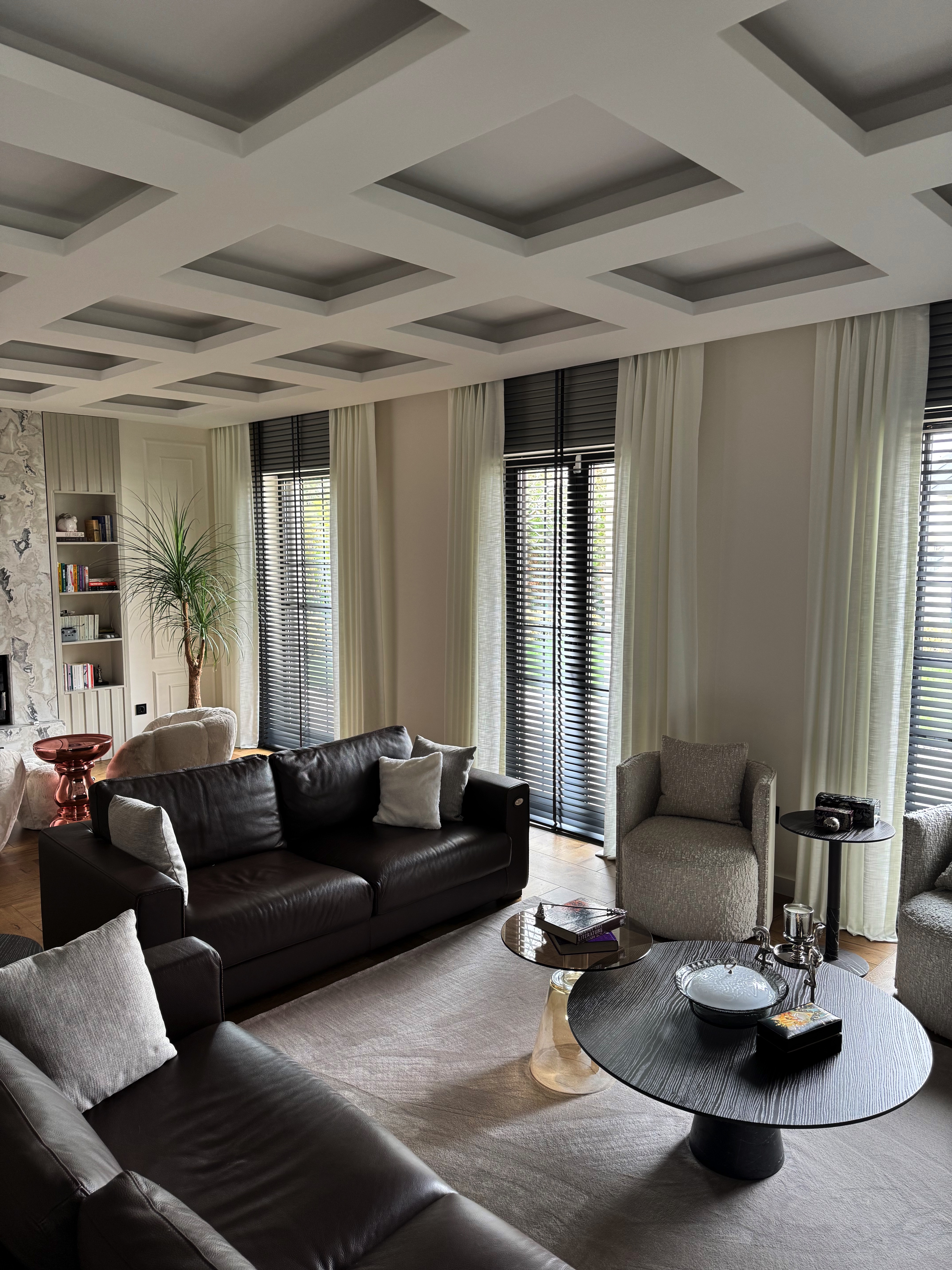 Double pinch-pleat linen curtains across the Angora Evleri living room windows