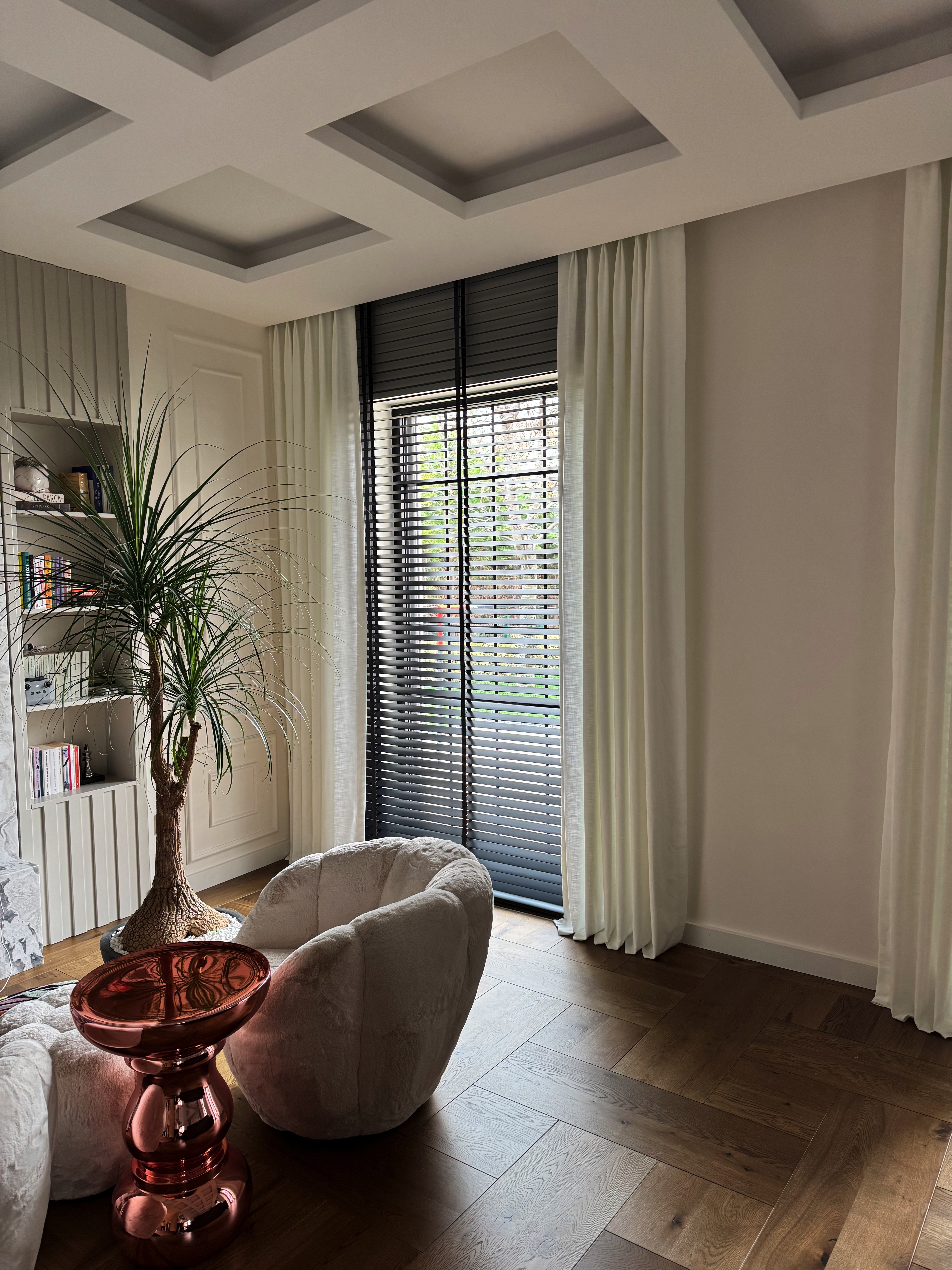 Wooden blinds and lightly puddled linen curtains at an Angora Evleri window