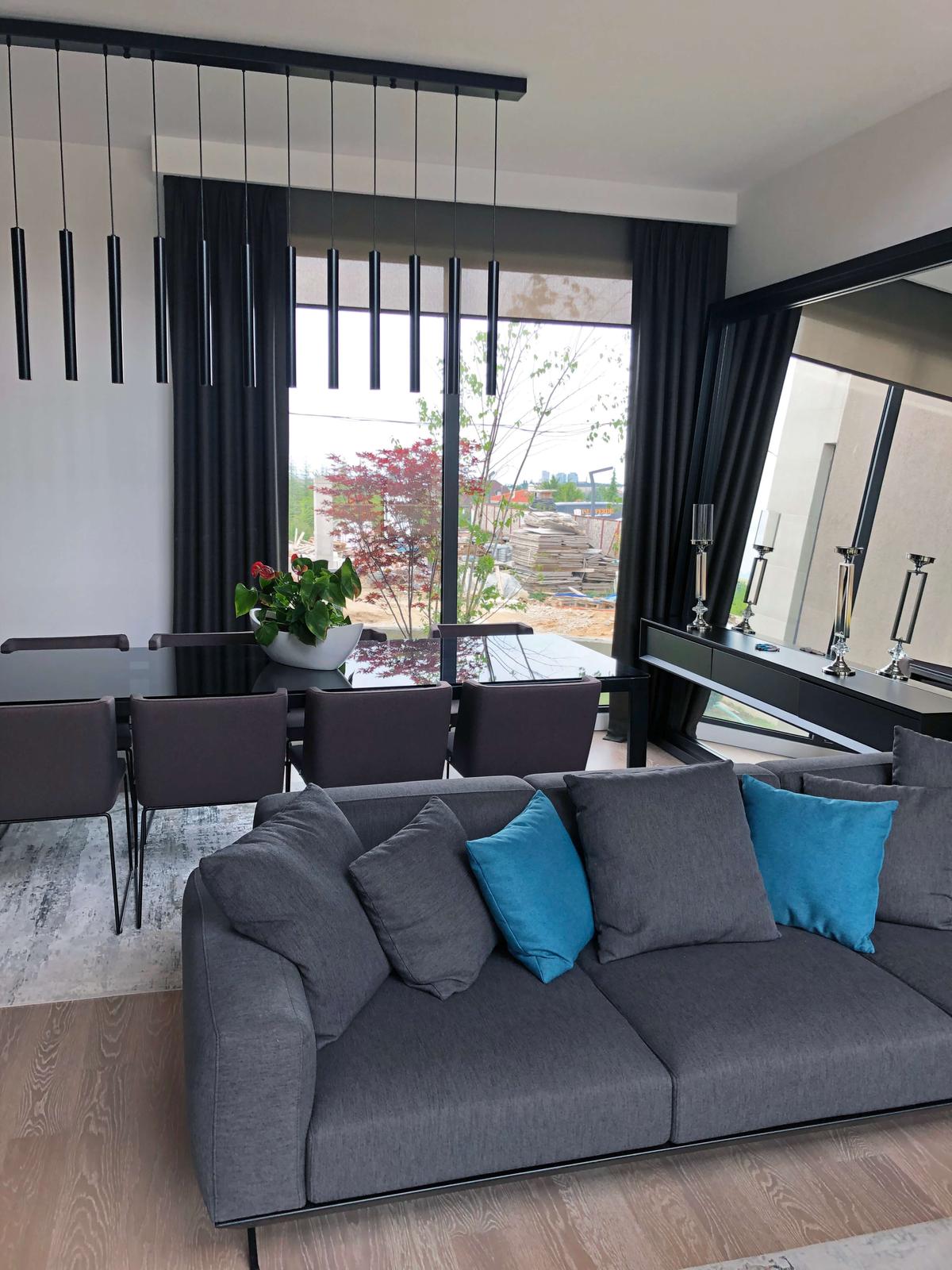 The hem line is considered with seating, floor and use of the window area.
